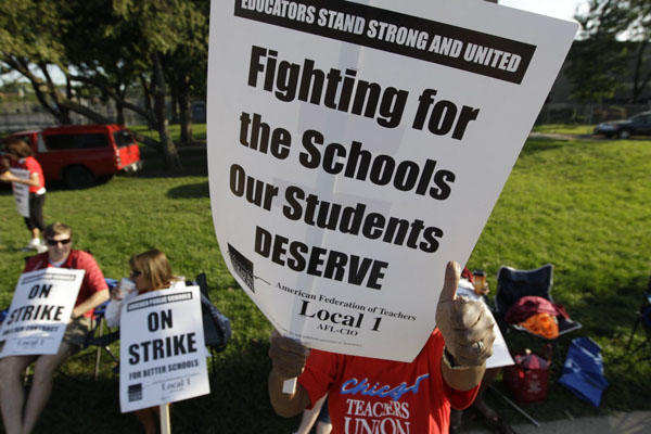 This sign from last summer's Chicago Teachers Union strike defines why and how parents and teachers can align.  (Source: Associated Press)