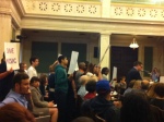 Parents and others line up to testify in favor of increasing city funding for schools.